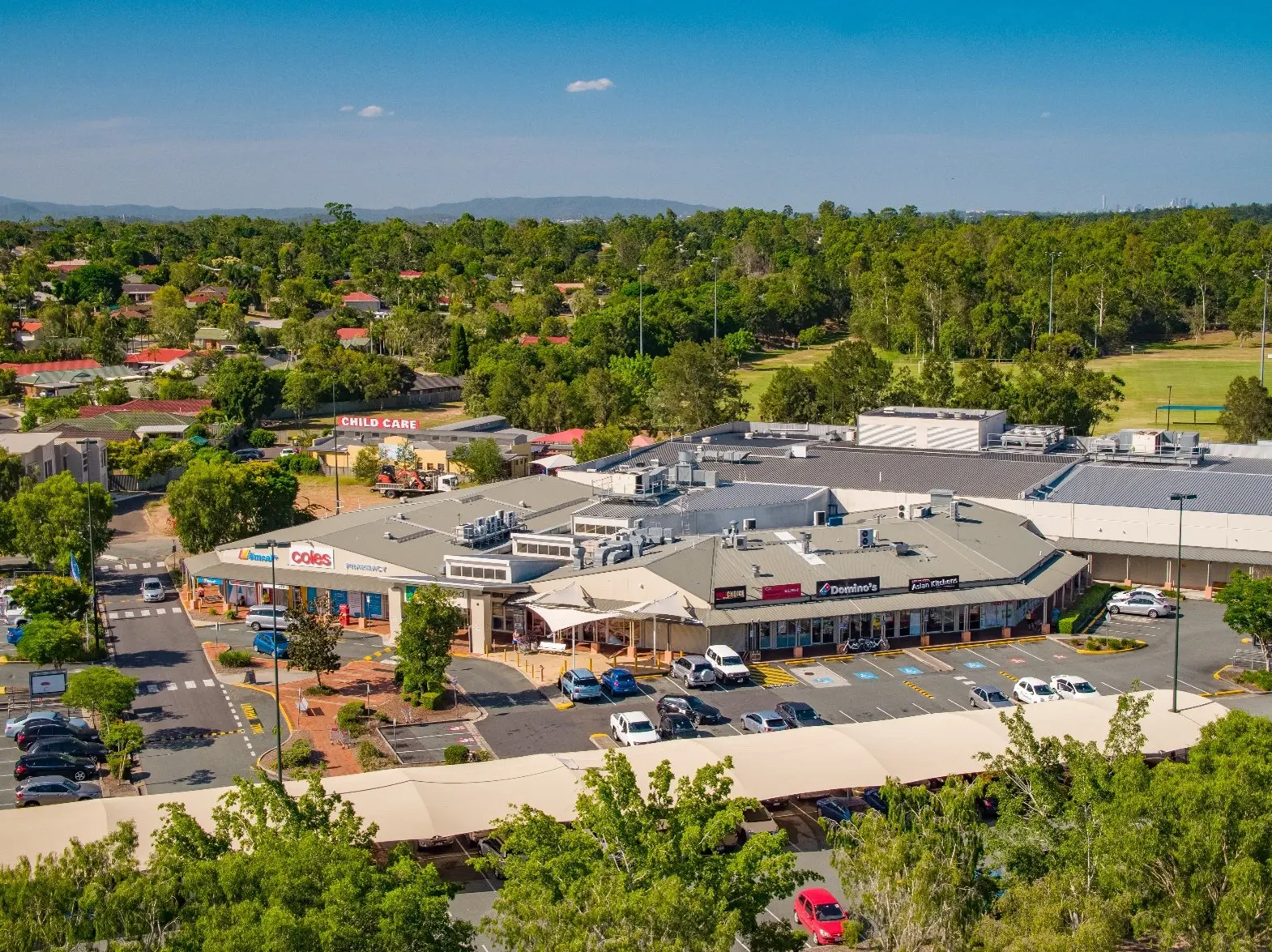 Aerial view of Springfield Fair, a fully leased neighbourhood shopping centre located in a growing area 30km south-west of Brisbane CBD managed under REIT and listed on ASX.